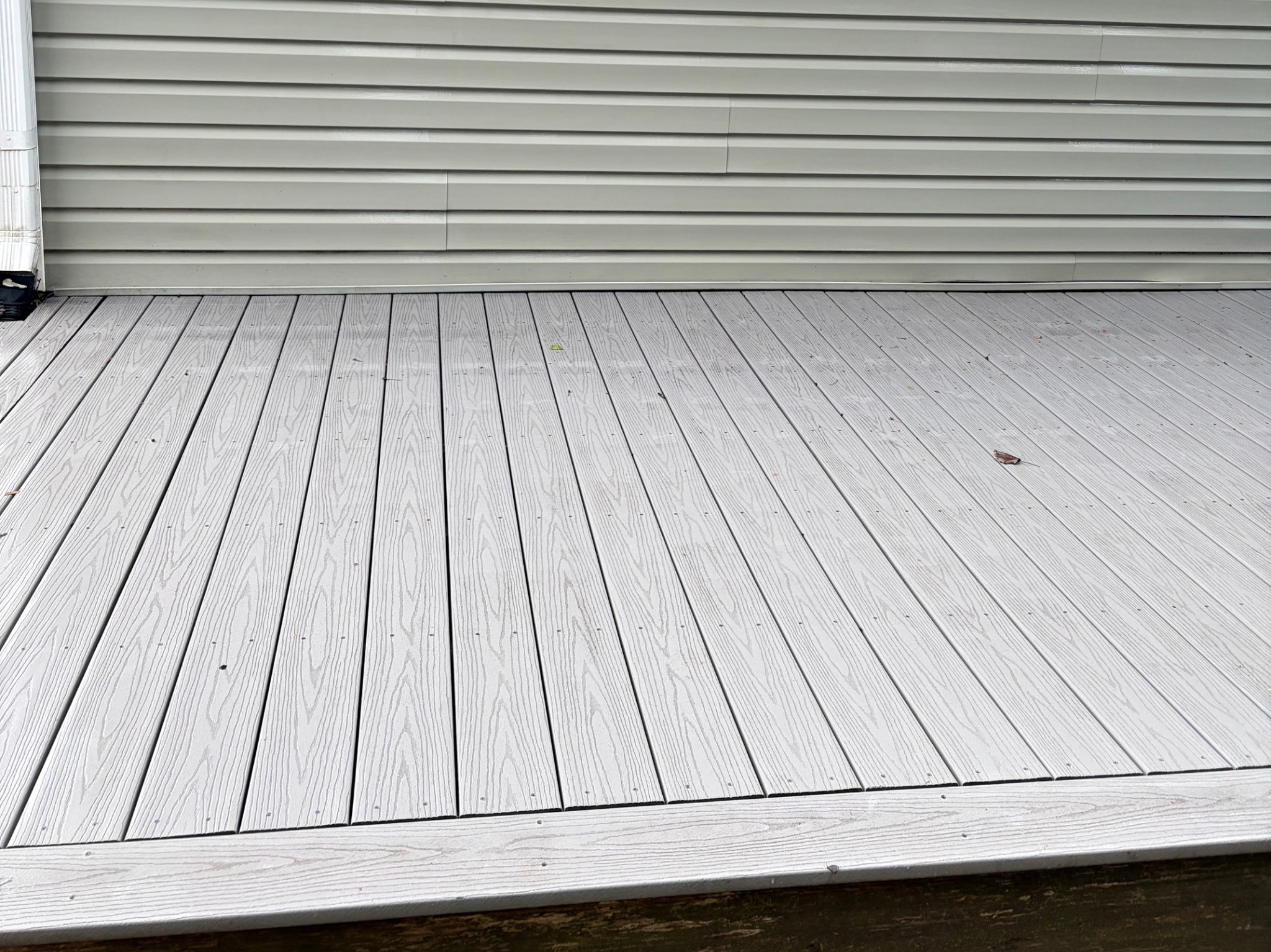 Deck after pressure washing looking brighter and cleaner