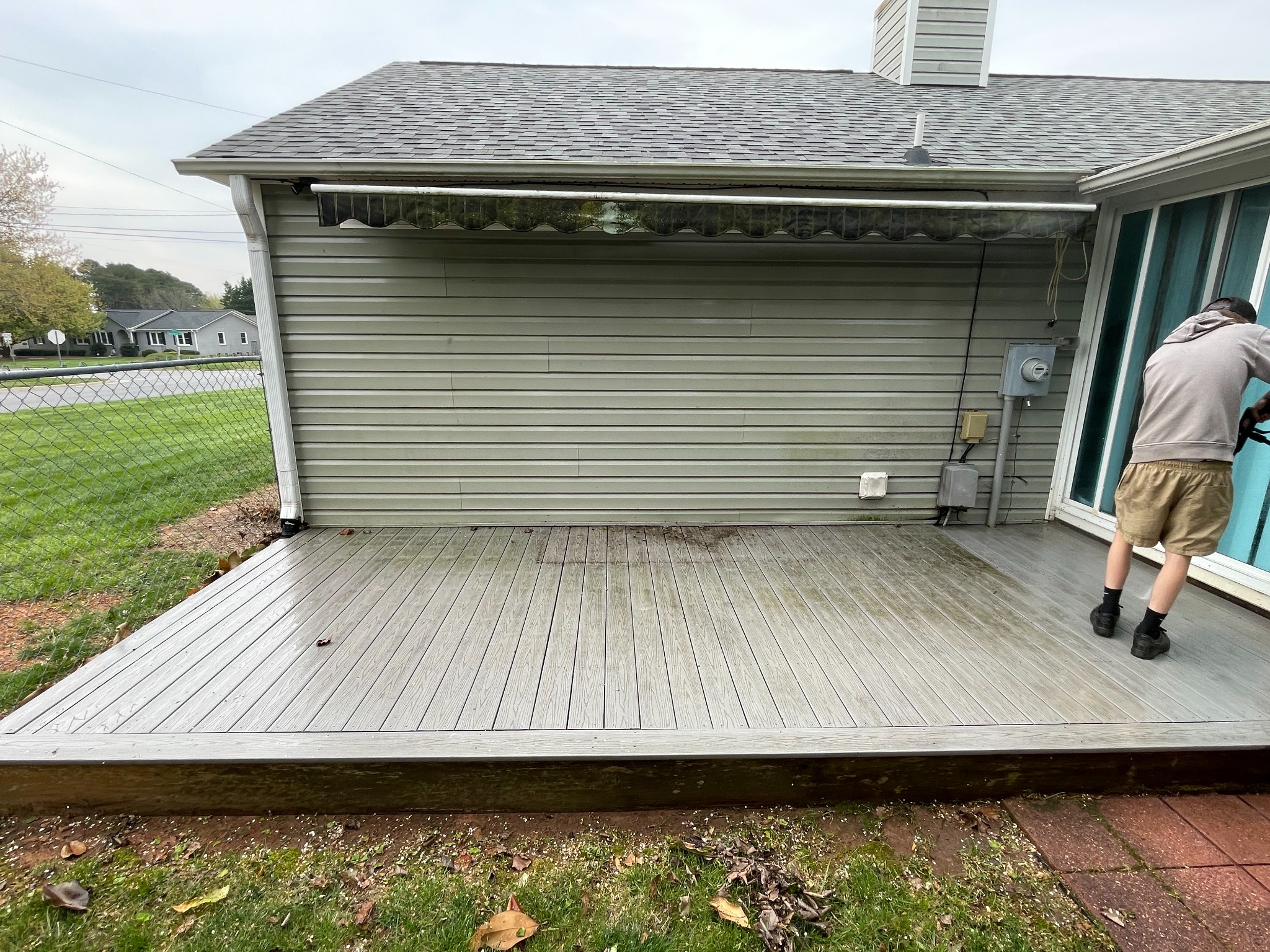 Deck before pressure washing with visible dirt and buildup
